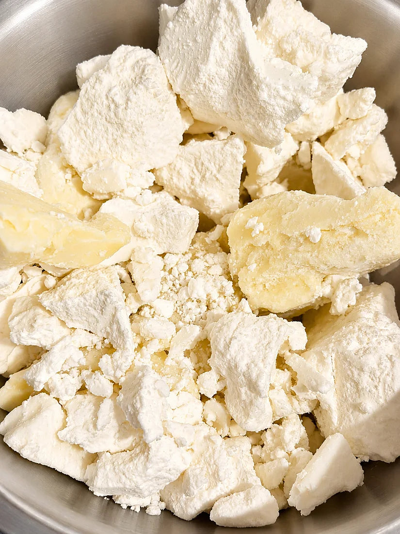 Raw shea and mango butters before blending